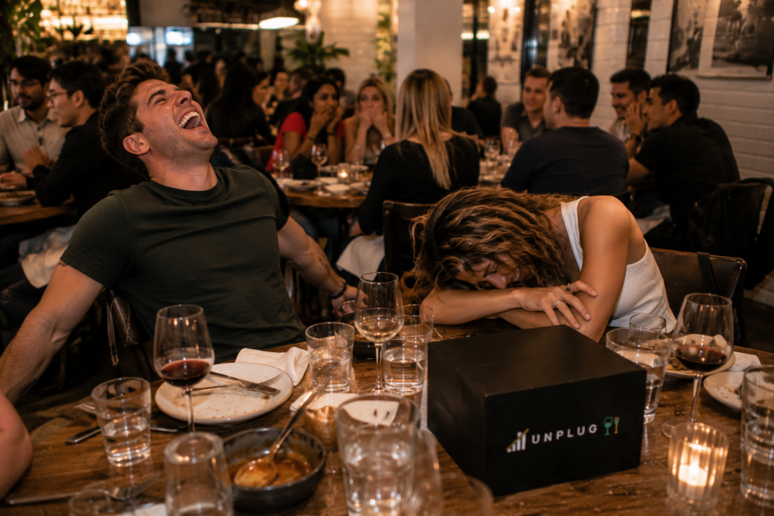 Two people laughing so hard at an UNPLUG night